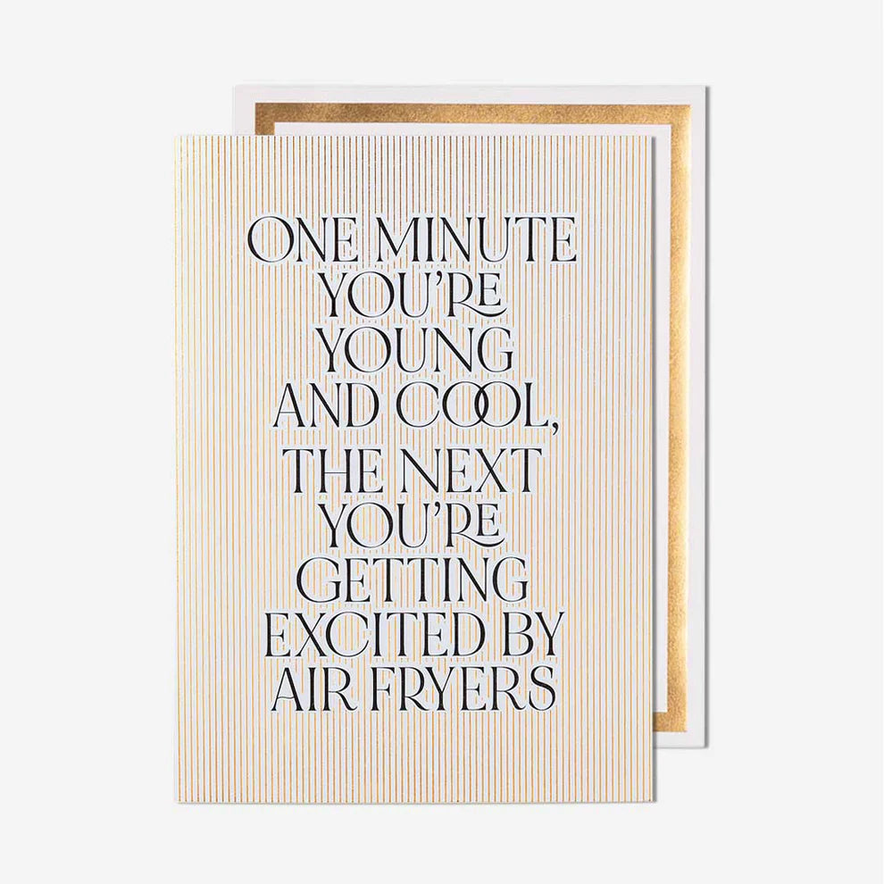 Card with humorous text about age and air fryers on a white background