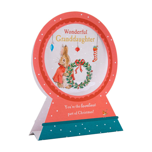 Christmas card with peter rabbit and friends decorating a tree, on a white background